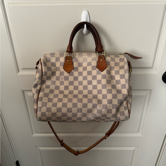 Worn and definitely used but still a great purse! Fits so much!! Love it!!